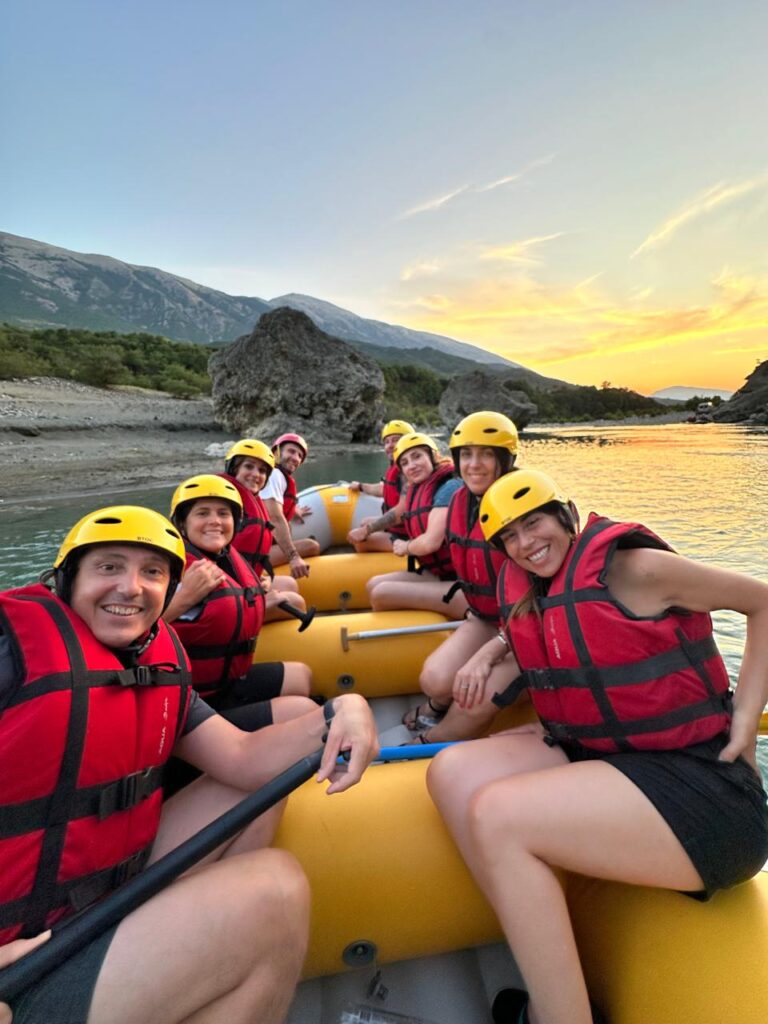 Rafting through rapids surrounded by mountains on the Vjosa River